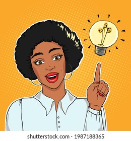 African american excited businesswoman pointing on lightning bulb, idea concept vector illustration in pop art style