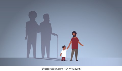 african american father with son holding hands shadow of young and mature man standing together imagination aspiration concept full length flat horizontal