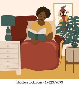 African american girl reading a book. Feminine Daily life and everyday routine scene by young woman in home interior with homeplants
