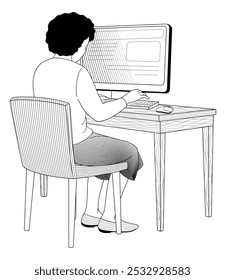 African American girl sits in a chair at a table working on a computer