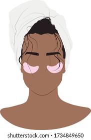 African american girl with a towel on her head. Hydrogel eye patches. Cosmetic collagen eye patches against facial wrinkles. Eye patches for beauty and skin care.