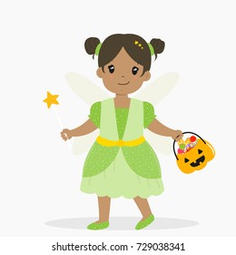 african american girl wearing fairy costume and holding a magic wand for Halloween party, carrying a pumpkin bucket full of candies. Halloween cartoon vector