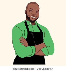 African American male business owner standing and folding his hands wearing a black apron smiling