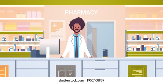 african american male doctor pharmacist standing at pharmacy counter modern drugstore interior medicine healthcare concept horizontal portrait