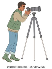 African American man birdwatching with telephoto camera on tall tripod in outdoor clothes