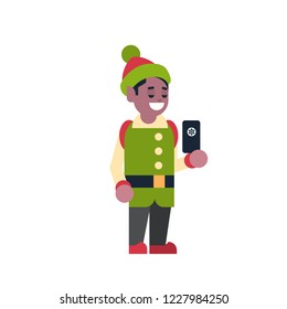 african american man elf santa claus helper hold smartphone merry christmas holiday happy new year concept male cartoon character full length flat vector illustration