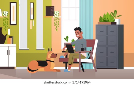 african american man freelancer using laptop working at home during coronavirus quarantine self-isolation freelance concept living room interior horizontal full length vector illustration