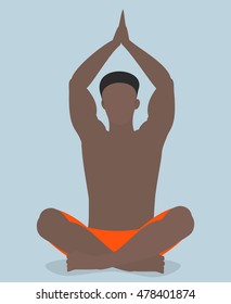 African American man practicing yoga , sitting in a pose