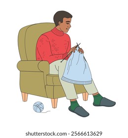 African American man sits in a chair and knitted 