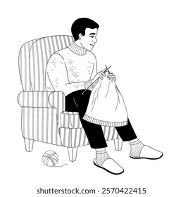 African American man sits in a chair and knitted