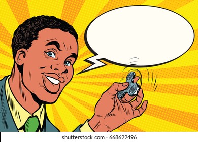 African American man with the spinner in hand. Pop art retro comic book vector illustration