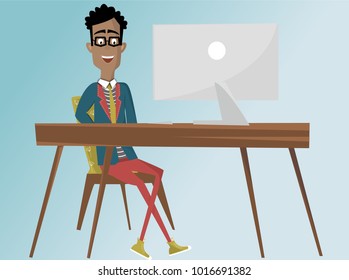 African American man working at his desk on his iMac.