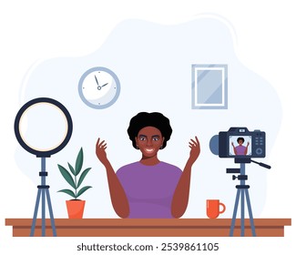 Video Una blogger afroamericana se graba a sí misma usando una cámara y una lámpara de luz circular. Vector Video personaje influencer creando una revisión para un blog. Ilustración plana