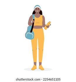 African American woman holding gym bag and bottle of water