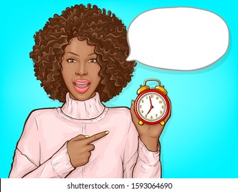 African american woman pointing by finger to red alarm clock. Black girl with afro hair and open mouth show time. Vector pop art illustration of dark skin lady with speech bubble