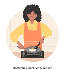 African American woman preparing breakfast and frying scrambled eggs in a cozy kitchen