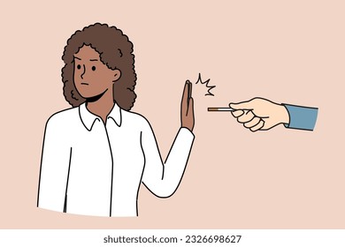 African American woman refusing to smoke making prohibition gesture near hand with cigarette made of tobacco and nicotine. Ethnic girl wants to quit smoke and fight addictive bad habits