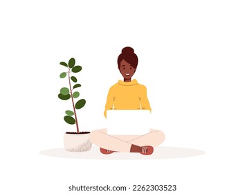 African American woman sitting cross-legged with a laptop working, studying or freelancing. Virtual office work concept.Vector illustration in flat style isolated on white background