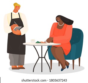 African american woman sitting on soft armchair at a table eating salad. Female character having lunch in a restaurant or cafe, girl waitress standing with a sheet of paper and a pen writes order