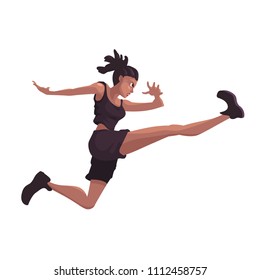 African American woman in a sporty suit is jumping against a white background