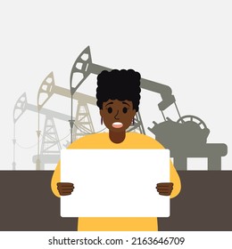 An African American women came out to protest with a white banner and shouts against the backdrop of oil and gas rigs. Black girl in the World oil crisis. Business Rig Platform petroleum extraction