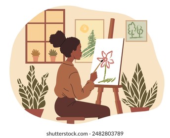 African American young woman painting at an easel. Girl draws a picture in a drawing studio. Hobby concept. Creative activities in free time