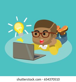 african boy playing laptop and get idea