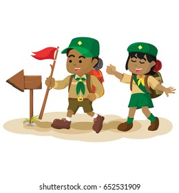 african boy scout following arrow sign