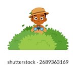 African boy using binoculars peeking from behind bush with curious expression