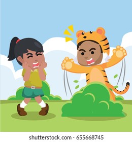 african boy wearing tiger costume surprising african girl