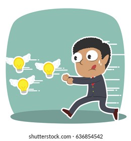 african businessman chasing flying ideas