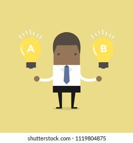 African businessman compares idea A to idea B.