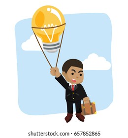 african businessman flying with bulb balloon