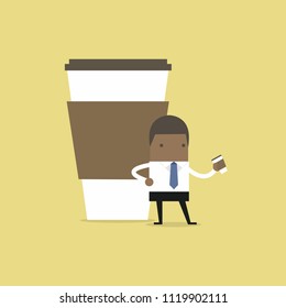 African businessman has coffee break.