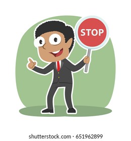 african businessman holding stop sign
