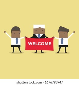 African businessman holding welcome sign.