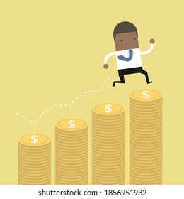 African businessman jumping on the money step.