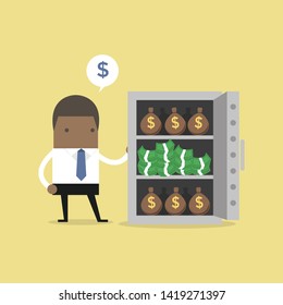 African businessman with a lot of money bags and stacks of dollars in safe.