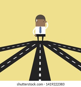 African businessman on crossroad choosing future direction to success or business strategy.