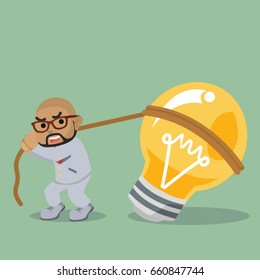 african businessman pulling bulb to stand