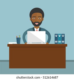 An African businessman sitting at the table and working on the computer in the office. Vector illustration, flat style