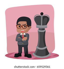 african businessman standing in front king chess piece