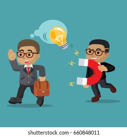 african businessman stealing other businessman bulb