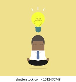 African businessman thinking during meditation.