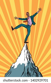 african businessman at the top of the mountain. Pop art retro vector illustration vintage kitsch