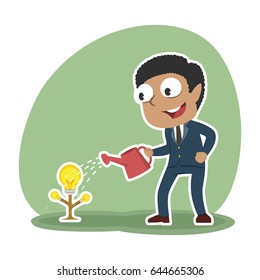 african businessman watering his idea tree for growing