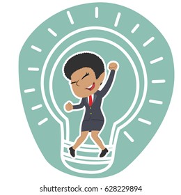 african businesswoman inside bulb