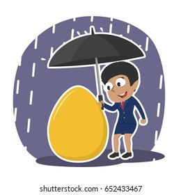 african businesswoman protecting her golden egg with umbrella