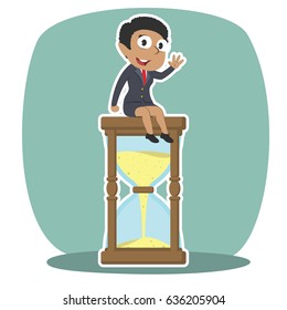 african businesswoman is sitting on hourglass