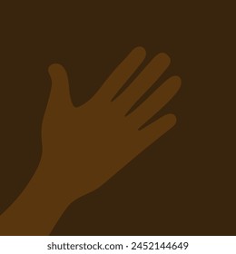 African dark-skinned person's hand on brown background